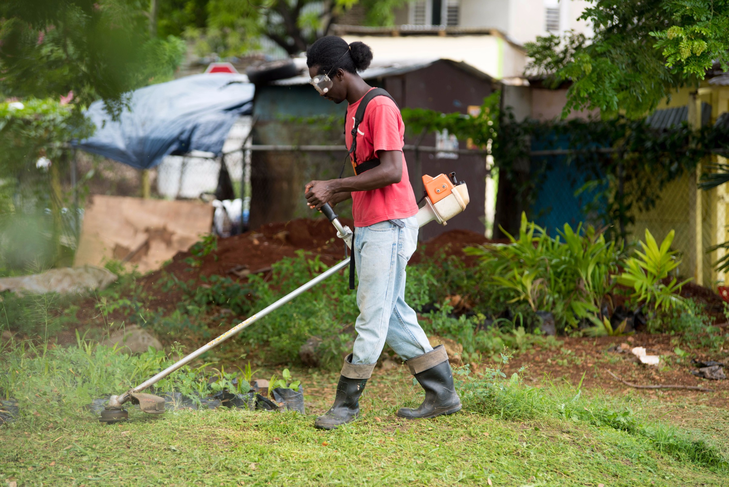 Worker Cutting School Ground